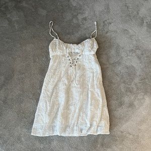 Princess Polly white lace dress 
Cutout and lacing
Perfect for summer!